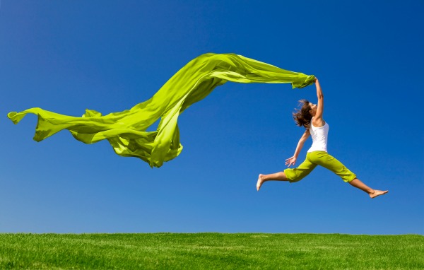 Lady with green material in the wind